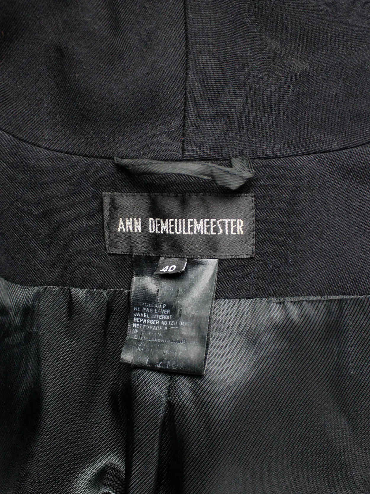 Ann Demeulemeester black cutaway tailcoat with curved buttoned front — fall 2006